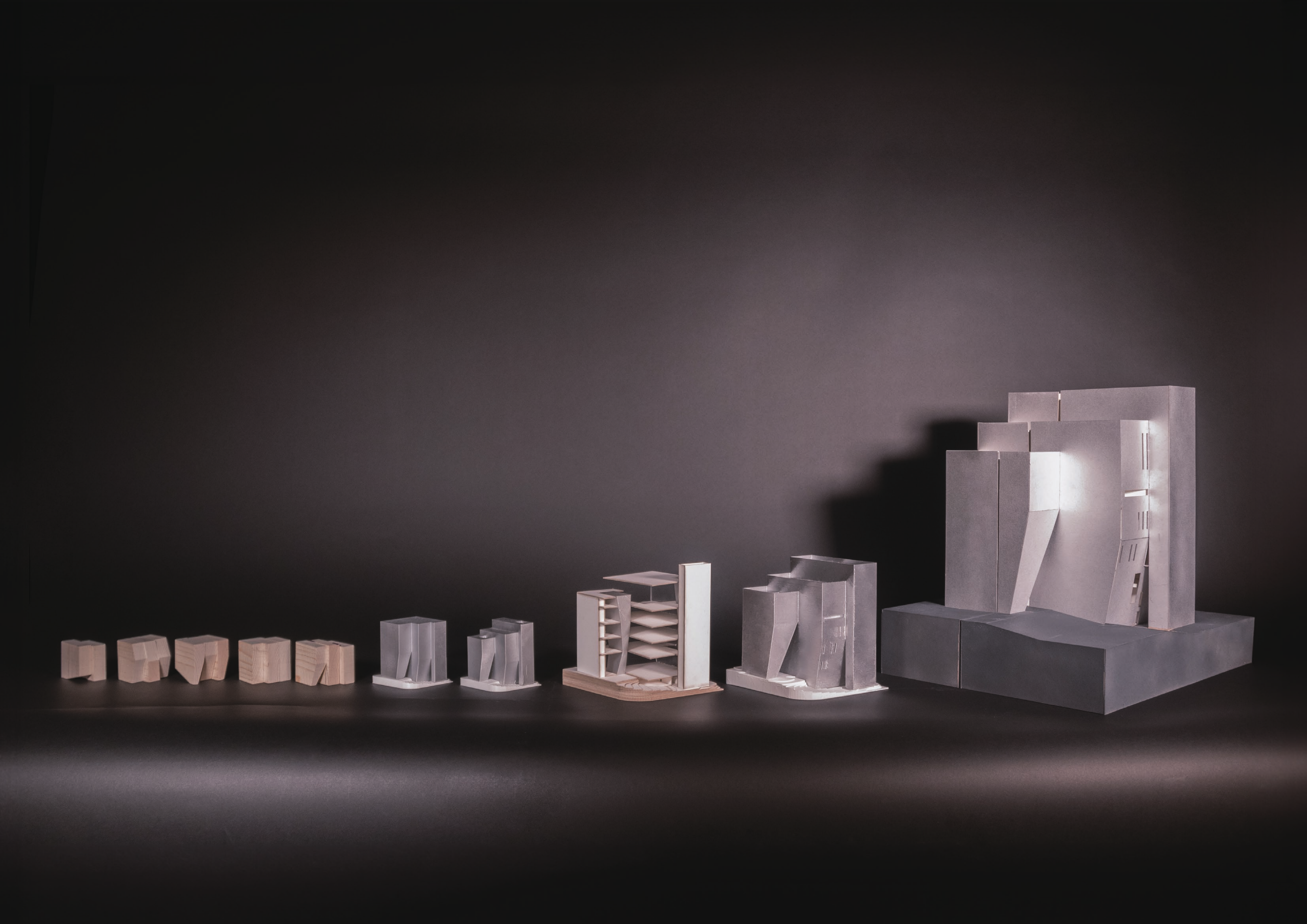 Sequence of physical studies developing from small material tests to a civic building