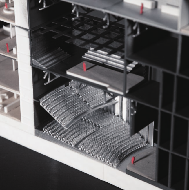 Close-up model of the stacked theater and performance spaces